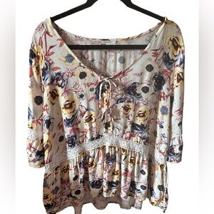 Maurice’s 0X cream pansy blouse with blue & yellow flowers. Cream lace detail.